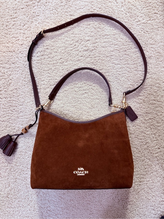 Coach Handbags - Coach Laurel Brown Suede crossbody Bag with Tassel Charm - new w/o never worn